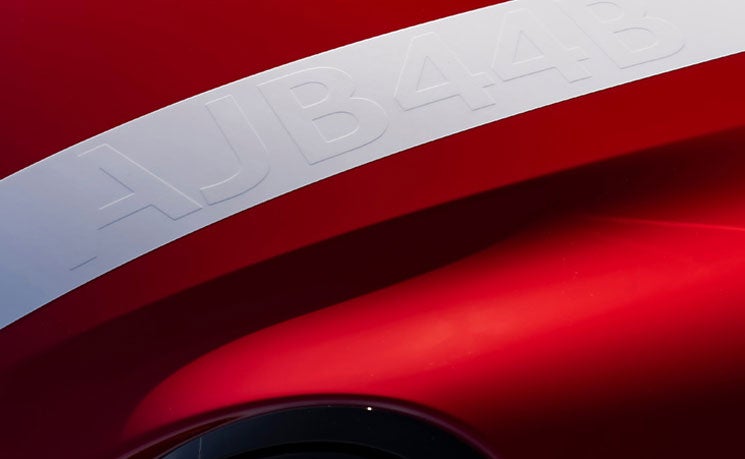 Close up on sport stripes spanning the bonnet, roof and boot on the 2026 JCW 2 Door roof and mirror caps.
